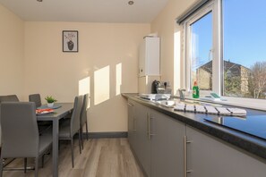 Fridge, microwave, toaster, dining tables