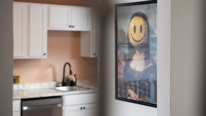 A modern kitchen with white cabinets and a sink. - 5 mins walk from The Harbour, The Rooms, and all the fun of Downtown St. John’s! (St. John's)
