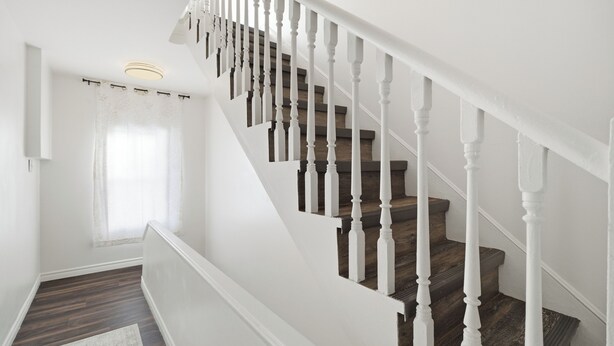 A staircase with white balusters and wooden steps. - 5 mins walk from The Harbour, The Rooms, and all the fun of Downtown St. John’s! (St. John's)