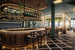 A bar area with a curved wooden counter, multiple bar stools, and a wine glass. There are shelves with bottles and plants above the counter. The room has a checkered floor and large windows with curtains.