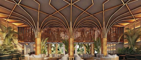 A spacious lobby with a geometric ceiling design, seating areas, and tropical plants.