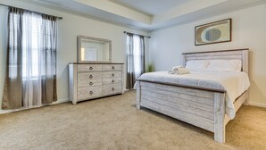 A bedroom with a bed, a dresser, a mirror, and curtains. - 4 Mi to Hospital & Dtwn Greensboro: Spacious Home (Greensboro)