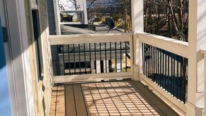 A wooden deck with a railing, a satellite dish, and a view of a neighboring house. - 5 min Walk to GWCC, Mercedes-Benz, World Cup! (Atlanta)