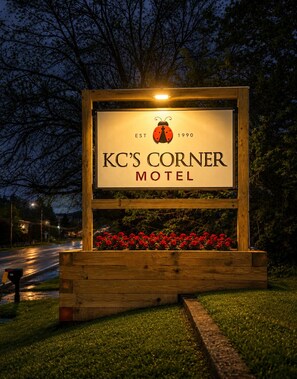 A wooden signboard for KC's Corner Motel with a logo, establishment year, and name. - KC's Corner Motel (East Springfield)