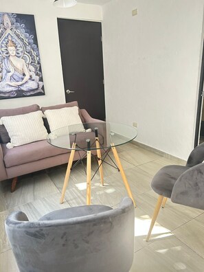 Suite estudio Confort | Área de sala de estar