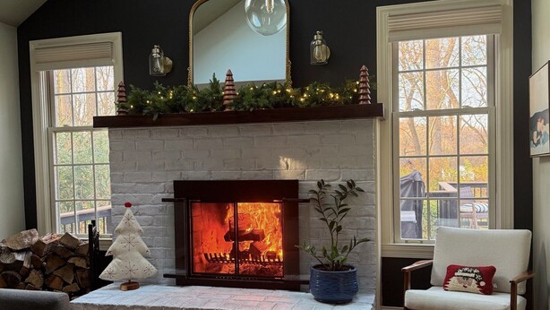 A cozy living room with a fireplace, a large mirror, and a comfortable seating area. - 1.7 Miles from PGA Championship - tremendous outdoor space with back deck (Berwyn)