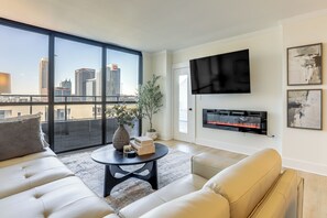 TV, fireplace - Balcony + Community Perks: Modern Atlanta Condo! (Atlanta)
