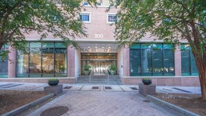 A building entrance with a sign reading "Peachtree Towers" and the number "300" above it. - Short walk to Centennial Park and Mercedes Benz (Atlanta)