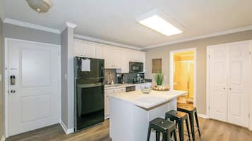 Fridge, stovetop, dishwasher, coffee/tea maker