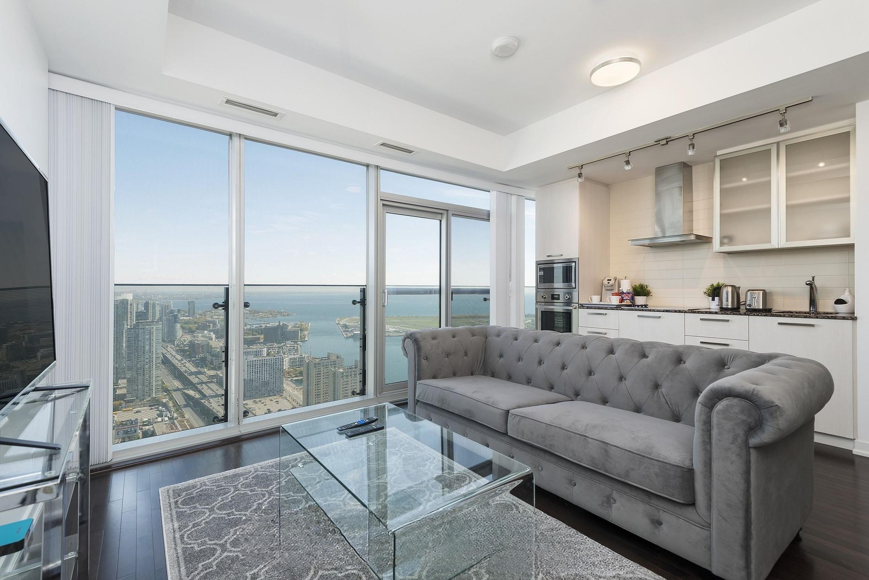 Executive Suite, 1 Queen Bed with Sofa bed | Living area | 65-inch TV with digital channels