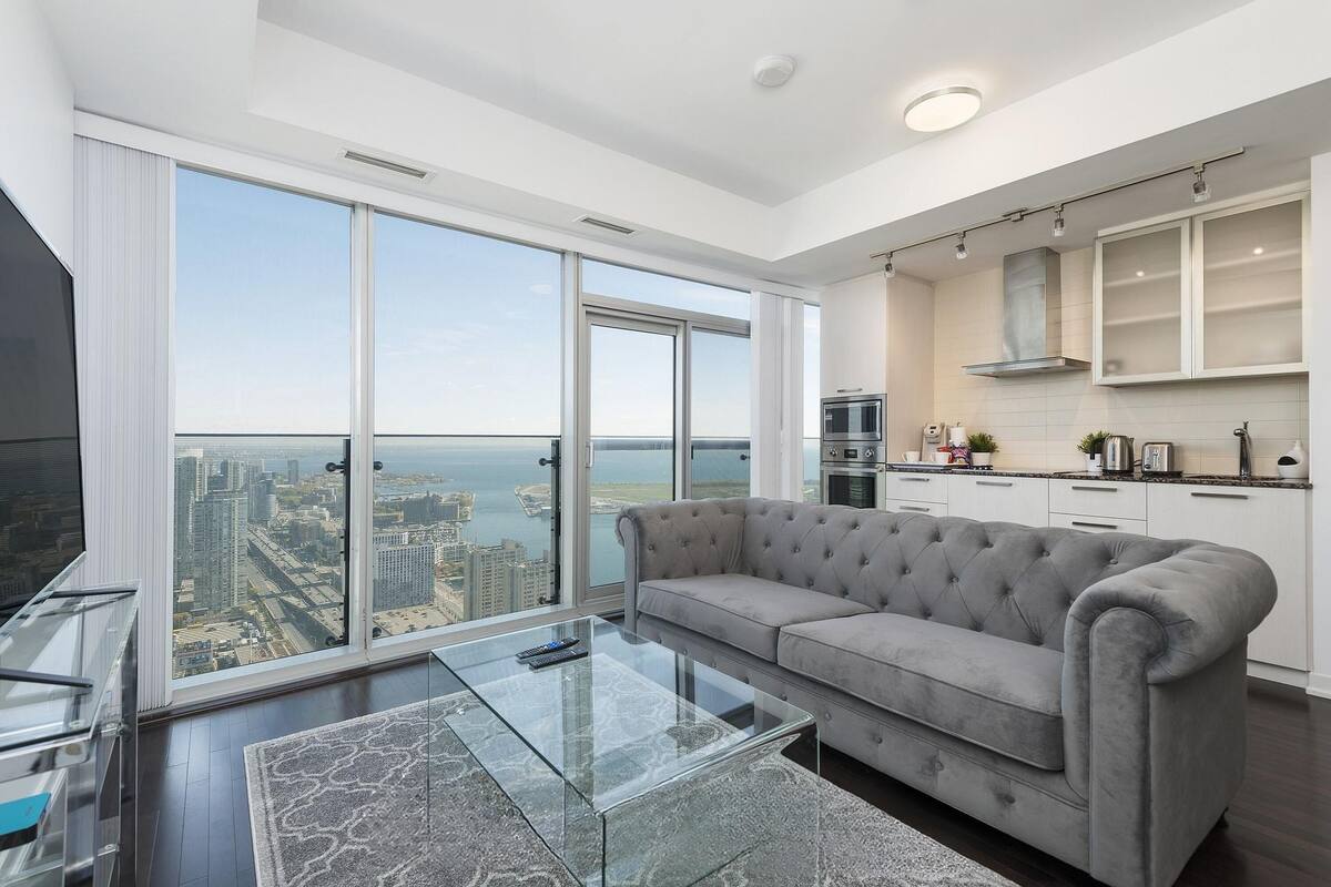 Executive Suite, 1 Queen Bed with Sofa bed | Living area | 65-inch TV with digital channels