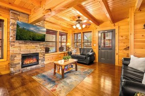TV, fireplace, table football - Charming Chalet Getaway in Prime Location, with Hot Tub & Pools (Pigeon Forge)