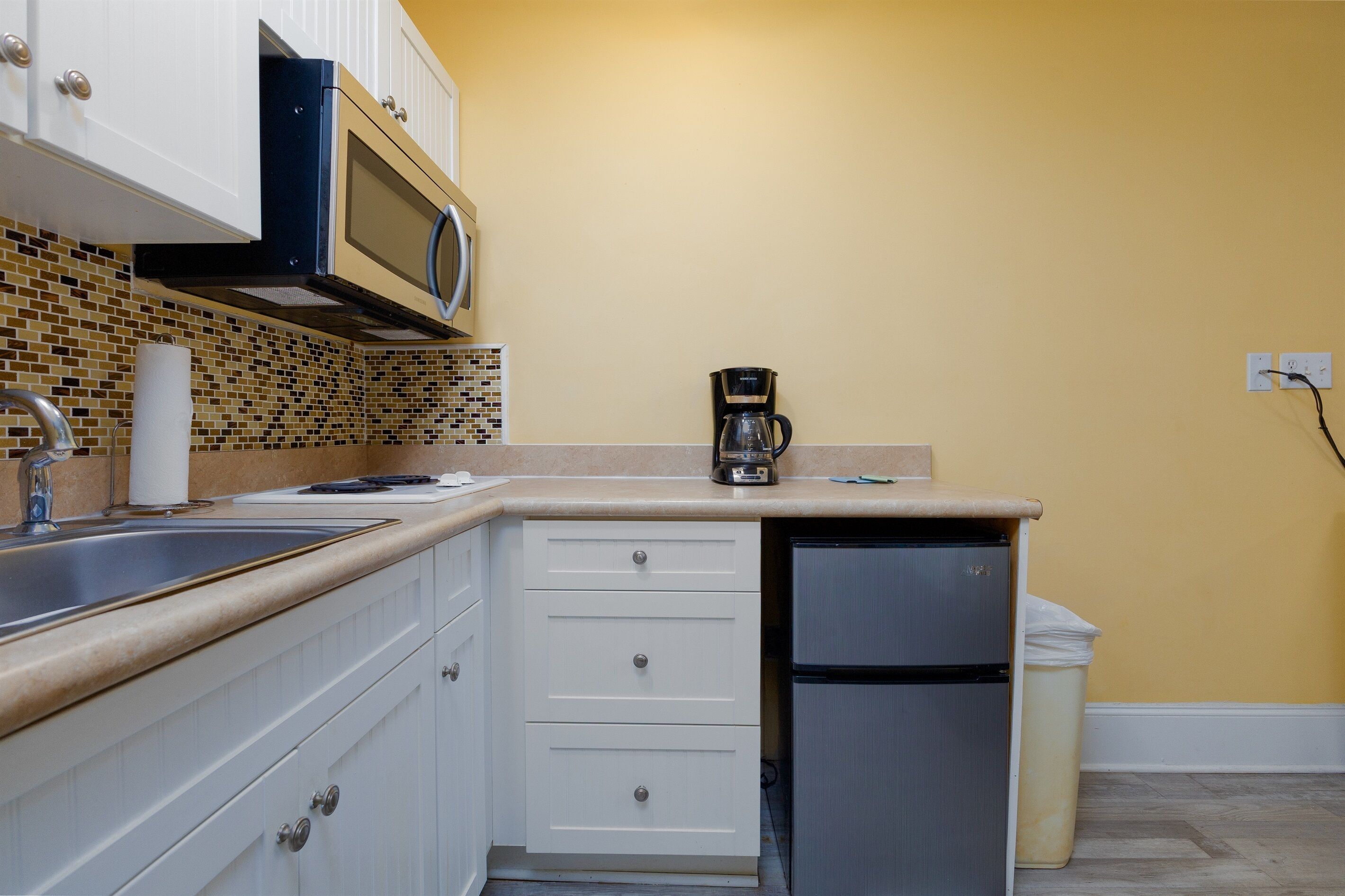 Fridge, microwave, stovetop, coffee/tea maker