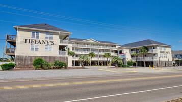 A multi-story hotel with balconies and a sign reading "TIFFANY'S".