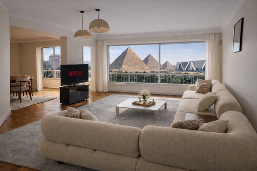 3 Pyramids + Grand Egyptian Museum View with a Roof Top | 3BR