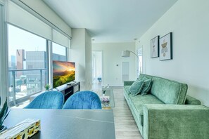 Superior Suite, 2 Bedrooms, Non Smoking | Living area | 65-inch TV with digital channels - Dundas East Hotel & Suites Toronto (Toronto)