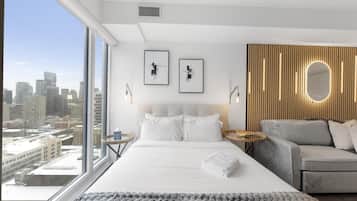 Classic Studio Suite, 1 Queen Bed with Sofa bed, Non Smoking | Living area | 65-inch TV with digital channels