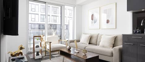 Premium Suite, 2 Bedrooms, Non Smoking | Living area | 65-inch TV with digital channels