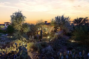 A desert landscape with cacti and a building with a red roof. - Luxury Aviation Retreat- Dual Primary Suites, Runway Views, Carefree, AZ (Carefree)