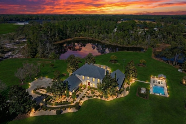 Private 10-acre French estate with twin lakes at sunset