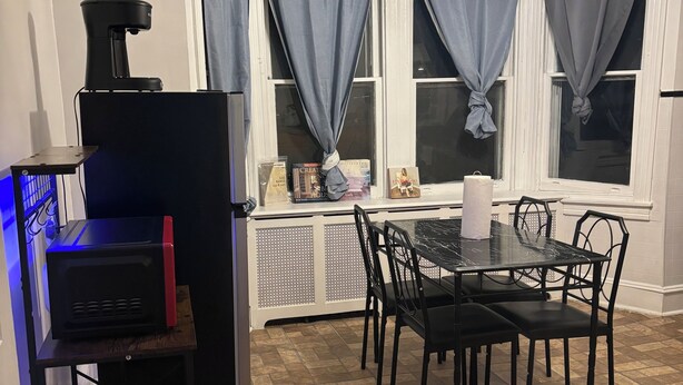 A compact kitchen with a dining area, a ceiling fan, and a window with curtains. - 2bedroom, No living room, EinsteinHospital & Salus University (Philadelphia)