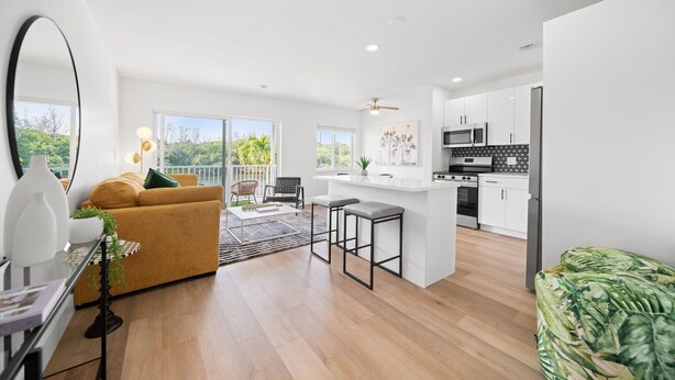 A modern apartment with a living room, kitchen, and balcony. - 261 #13 Managed by Brampton Park (Deerfield Beach)