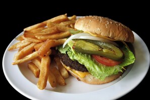A hamburger with fries on a white plate. - Motel Virreyes  (Mexicali)