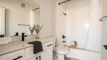 Shower, hair dryer, towels, shampoo