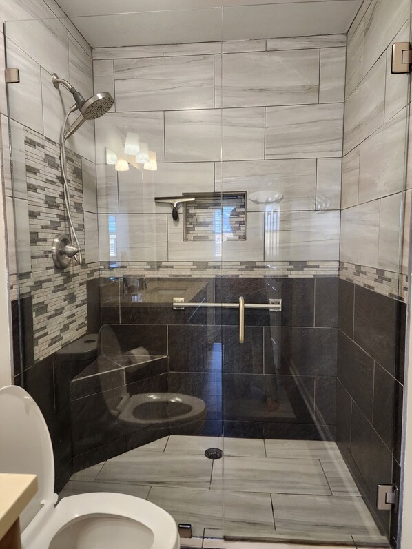 Shower, hair dryer, towels, toilet paper