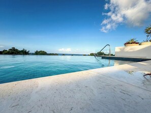 Outdoor pool - Alora West Coast Retreat • Infinity Pool · Steps to the Beach · Spacious 2BR 2BA (Saint James)