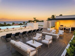 Outdoor dining - Alora West Coast Retreat • Infinity Pool · Steps to the Beach · Spacious 2BR 2BA (Saint James)