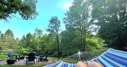 Northern Michigan Woodland Retreat - Cozy Comfort Near City Conveniences