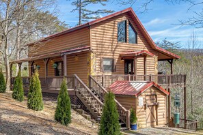 A log cabin with a balcony and a staircase leading to the main entrance. - Hot Tub + Mtn Views: Peaceful Blue Ridge Retreat! (Blue Ridge)