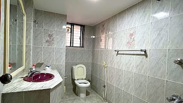 Separate tub and shower, hair dryer, slippers, towels