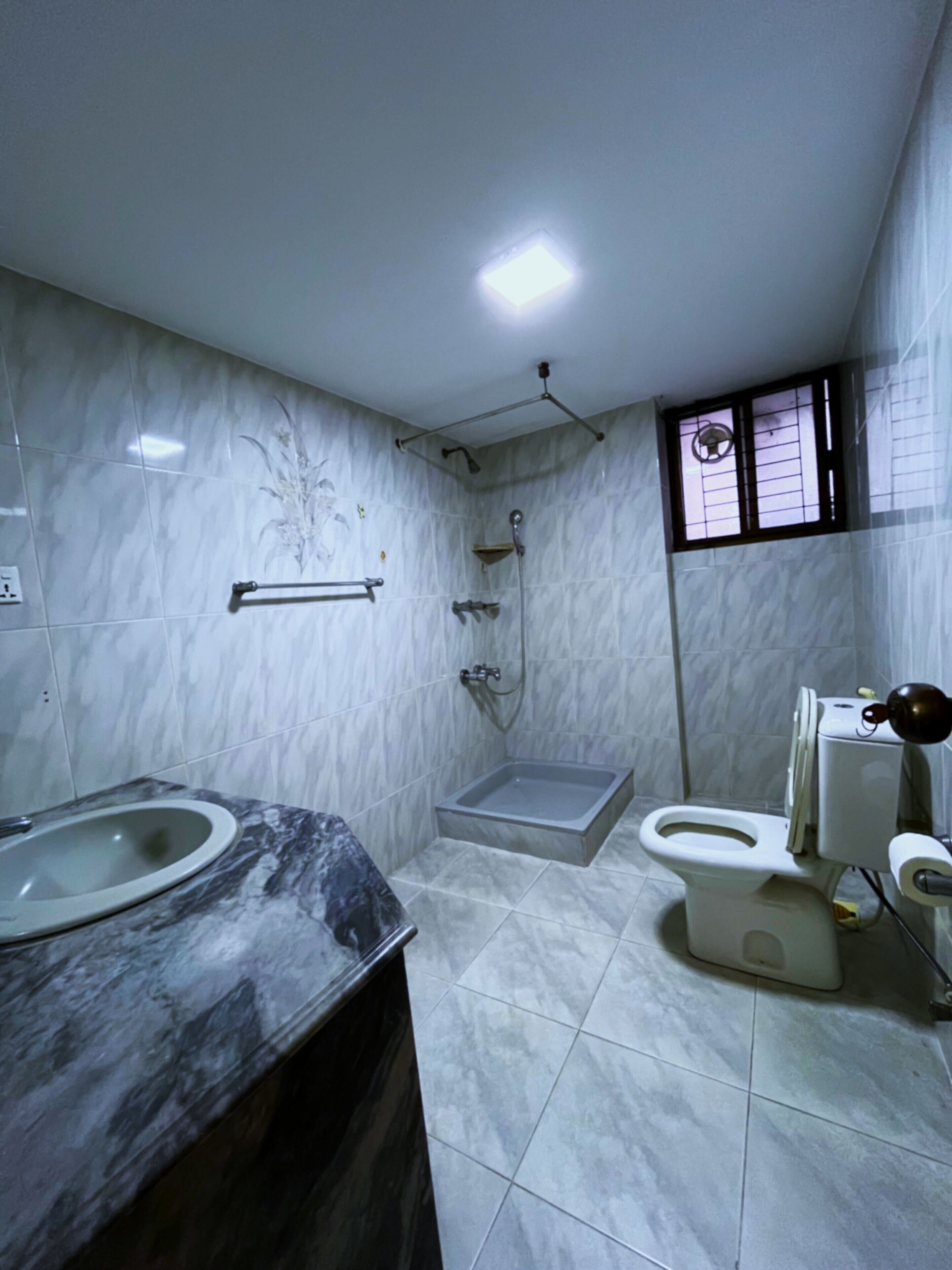 Separate bathtub and shower, hair dryer, slippers, towels