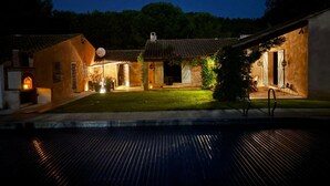A courtyard with a pool, surrounded by buildings with terracotta roofs and outdoor seating areas. - La Maisonnette by Interhome (Le Val)