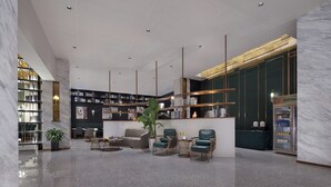 A modern lobby with a marble reception desk, green upholstered chairs, a seating area with a sofa and coffee table, and a large bookshelf. - Xi'an waya hotel (Xi'an)