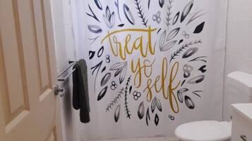 Shower, towels, soap, toilet paper