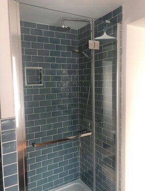 Shower, hair dryer, towels, toilet paper