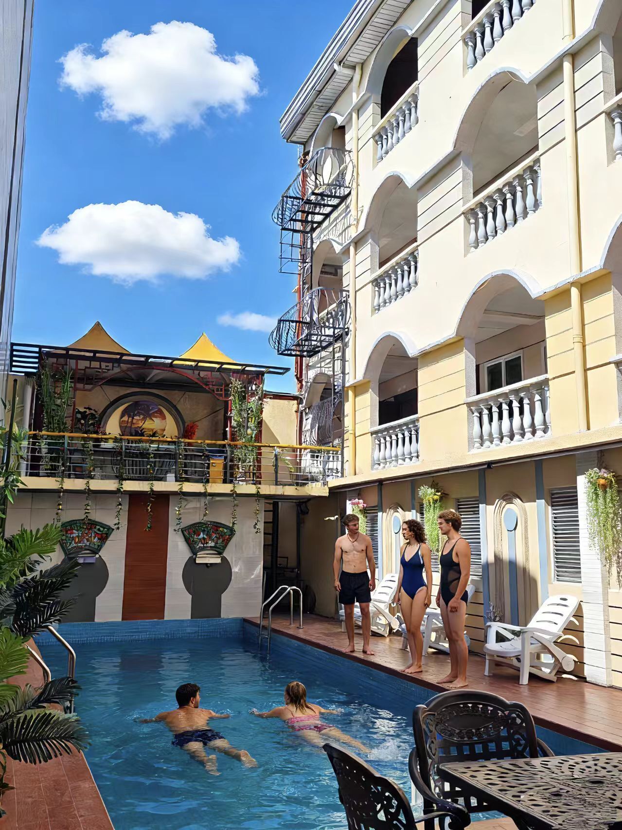 Outdoor pool, open 10:00 AM to 11:00 PM, pool loungers