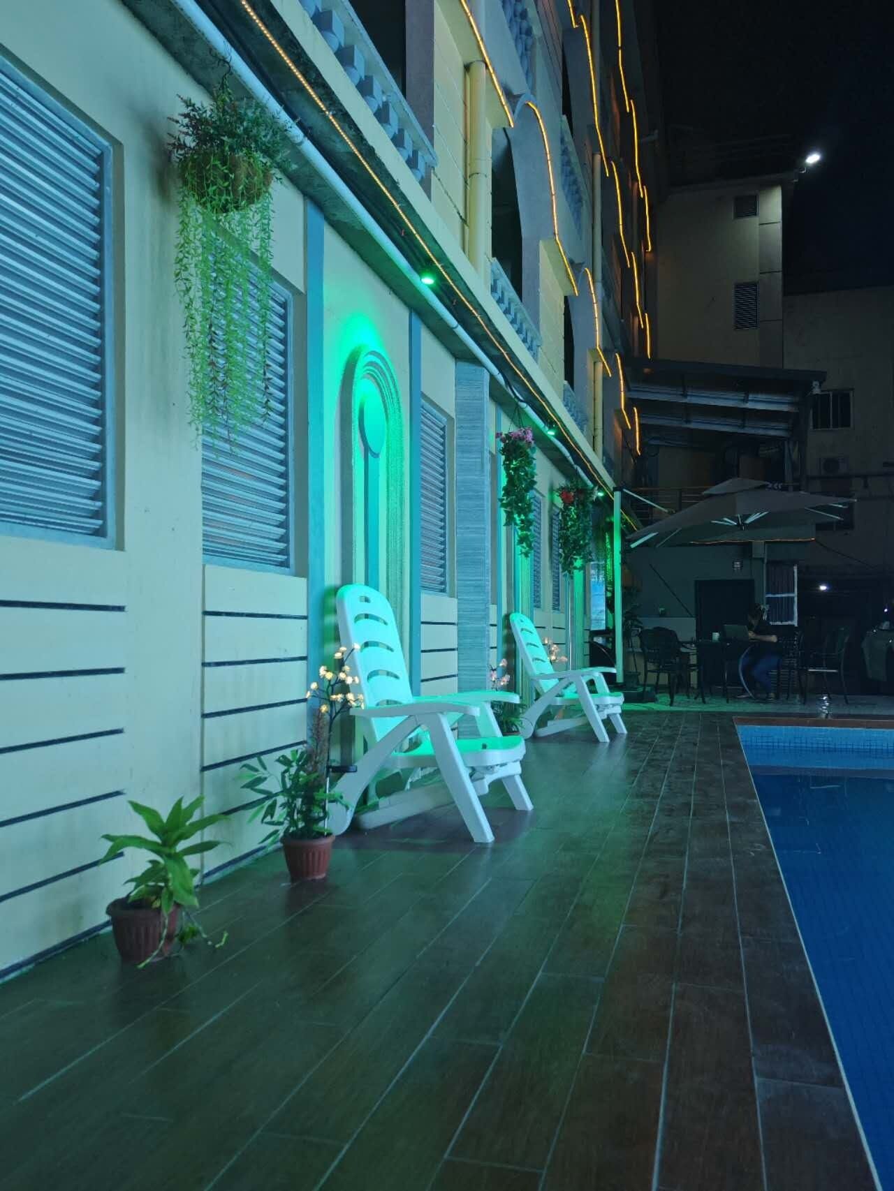 Outdoor pool, open 10:00 AM to 11:00 PM, pool loungers