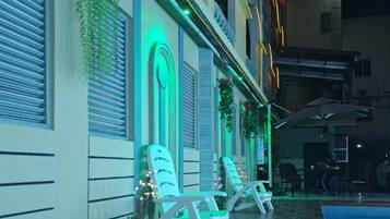 Outdoor pool, open 10:00 AM to 11:00 PM, pool loungers