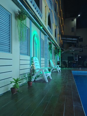 Outdoor pool, open 10:00 AM to 11:00 PM, pool loungers