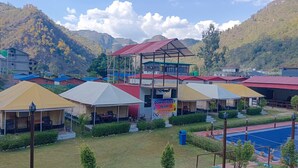 A resort with multiple tents and a swimming pool. - Down Valley Resort (Rishikesh)