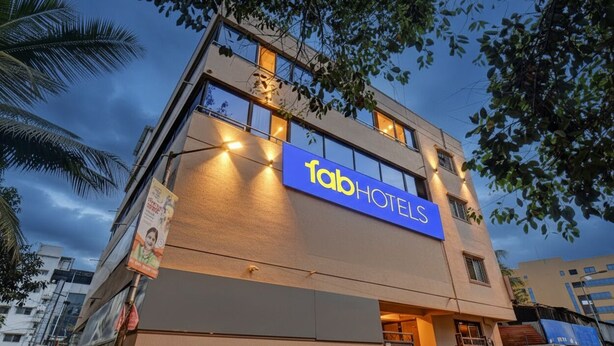 A modern building with a prominent 'fab hotels' sign. - Fabhotel Dream Sky (Pune)