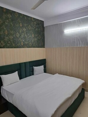 Habitación Deluxe | Sábanas de algodón egipcio, ropa de cama de alta calidad, wifi gratis