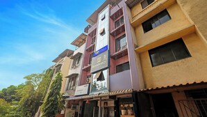 A multi-story building with a sign for 'Fab Hotels' and 'AR Residency'. - Fabhotel Ar Residency (Mumbai)