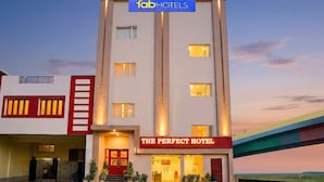 A hotel with a sign reading 'The Perfect Hotel' and 'Tab Hotels' above. - Fabhotel The Perfect (Lucknow)