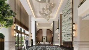 A modern hotel lobby with a marble wall, a geometric ceiling design, and a reception desk. - Holiday Inn Nantong Rudong by IHG (Nantong)