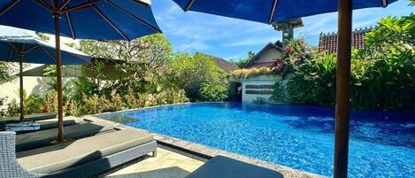 Outdoor pool, pool umbrellas, pool loungers
